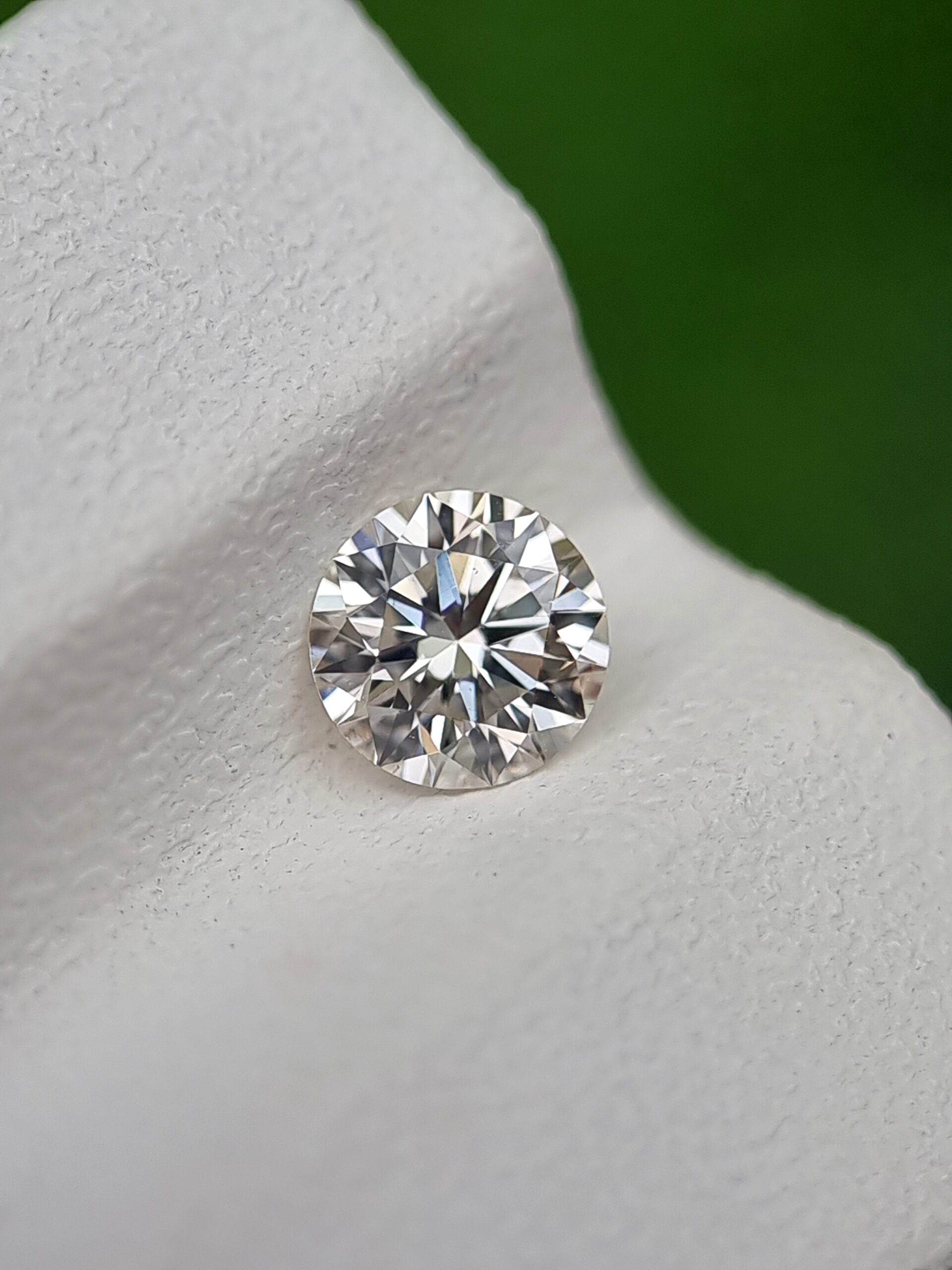 0.50ct Round Brilliant Cut Natural Diamond - J Color, SI1 Clarity, Strong Blue Fluorescence, Certified
