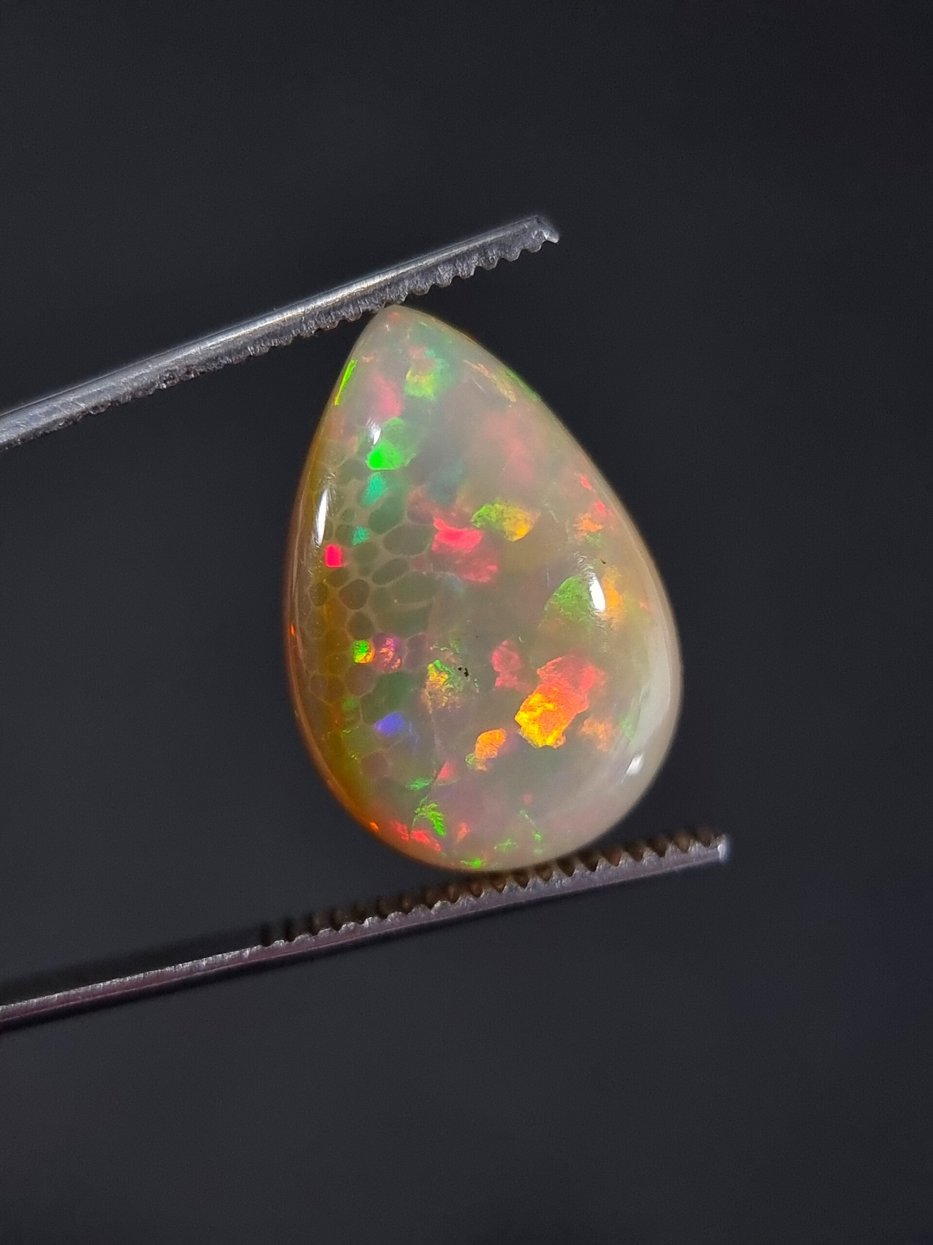 11.54 ct Natural Slightly Orangish White Opal Pear Cut Gemstone